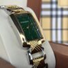 ساعة – سلفر مع ذهبي ارضية خضراء